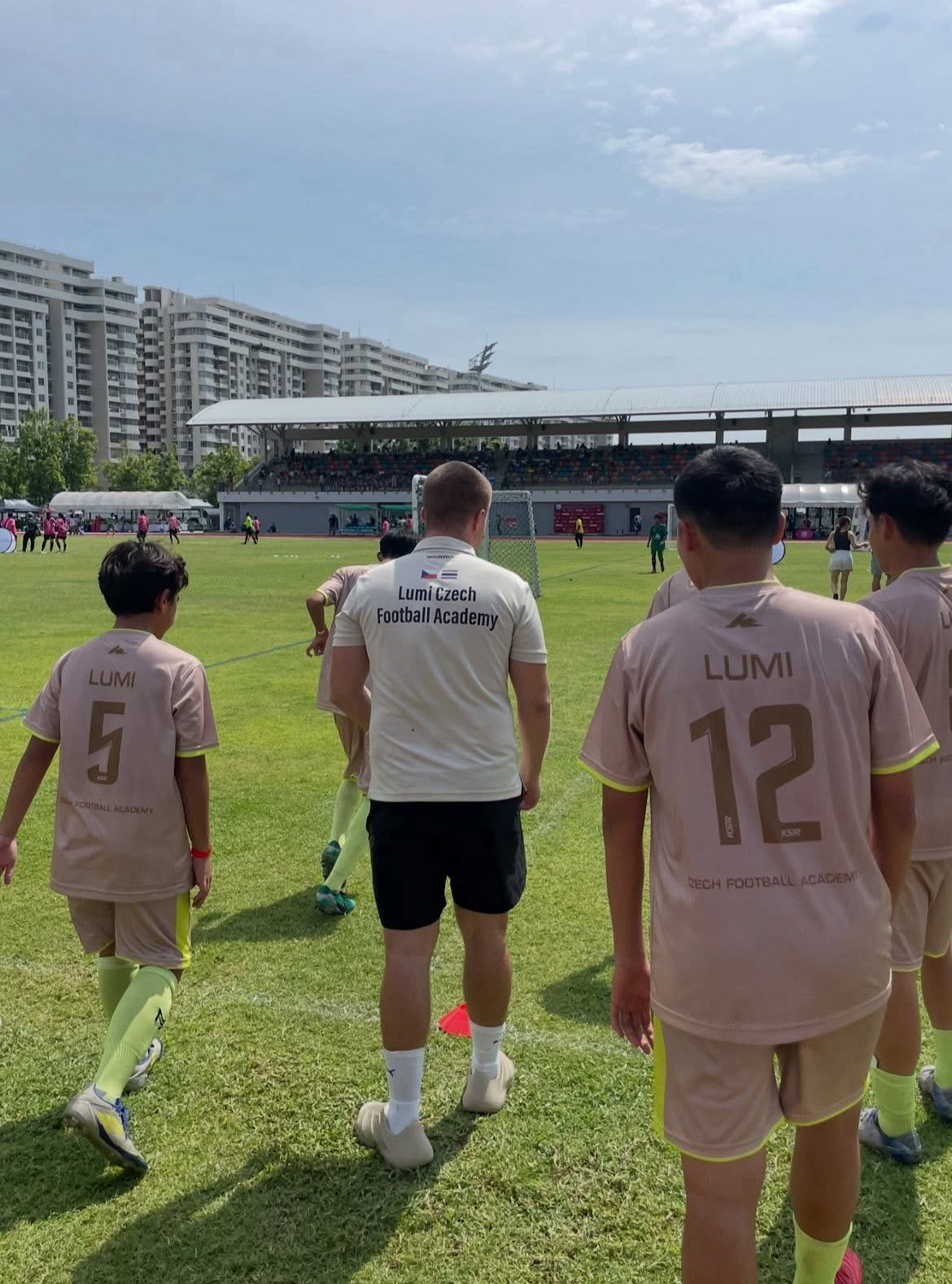 LUMI Czech Football Academy players walking onto the pitch before a match